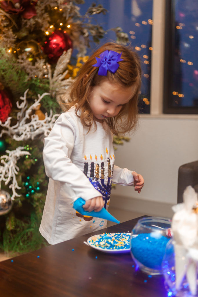 Child cookie decorating  at Hanukkah party in Santa Suite at Swissôtel Chicago